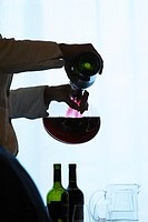 sommelier decanting wine