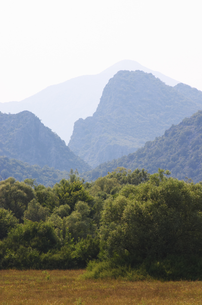 Dramatic steep mountains seen from the plain.