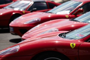 Red cars in a parking lot