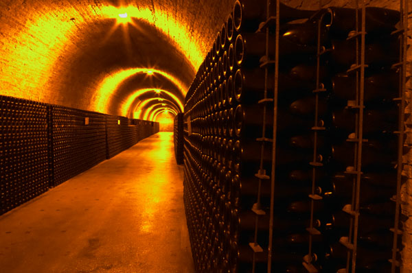 Underground corridor with thousands of bottles of champagne