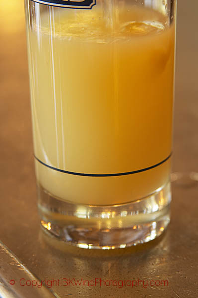 A glass of Ricard pastis on a zinc bar in a cafe in Paris