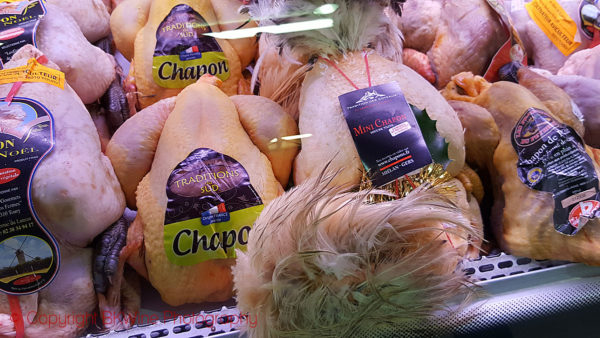 Capon at a market in Paris