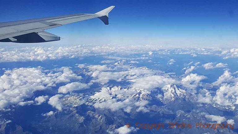 Flying over the Alps mountains a sunny day