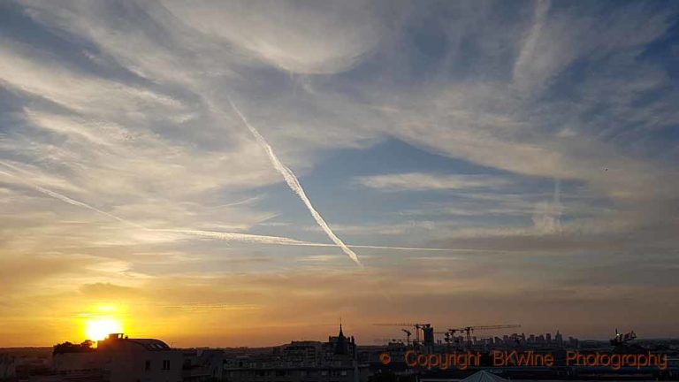 Pretty evening skies over Paris, with La Defense obscured by cranes