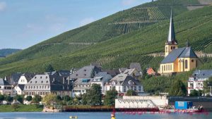 Vineyards on steep slopes and a village on the Mosel River, Germany