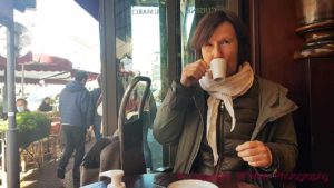 Britt Karlsson enjoying a coffee in a café in Paris on a cold day