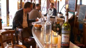 Bottle of Ricard pastis on a zinc bar in a cafe in Paris