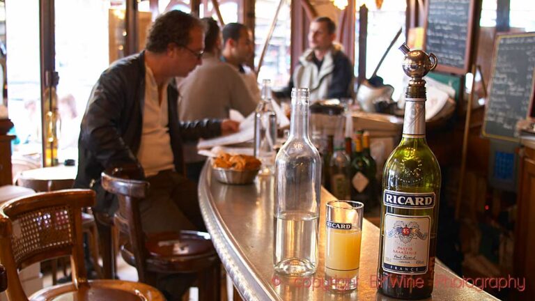 Bottle of Ricard pastis on a zinc bar in a cafe in Paris